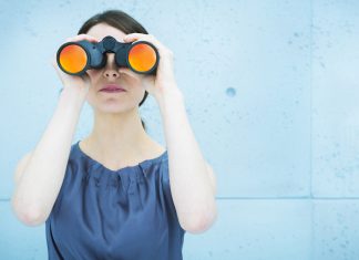 woman holding binoculars