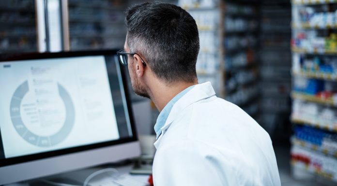 pharmacist using a computer